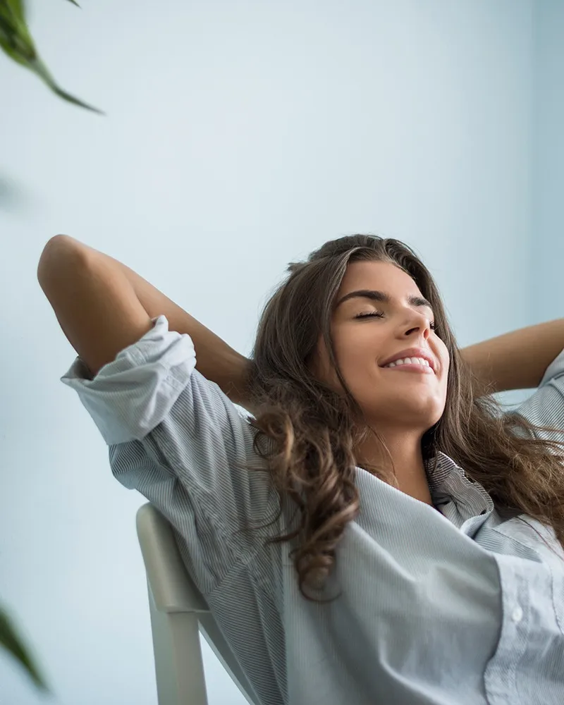 Woman with long hair relaxing after visiting the orthodontist