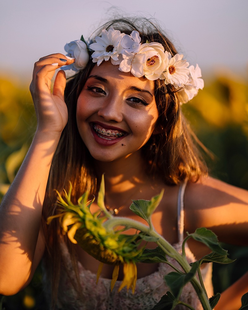 Woman with braces in Blaine MN wearing a flower crown