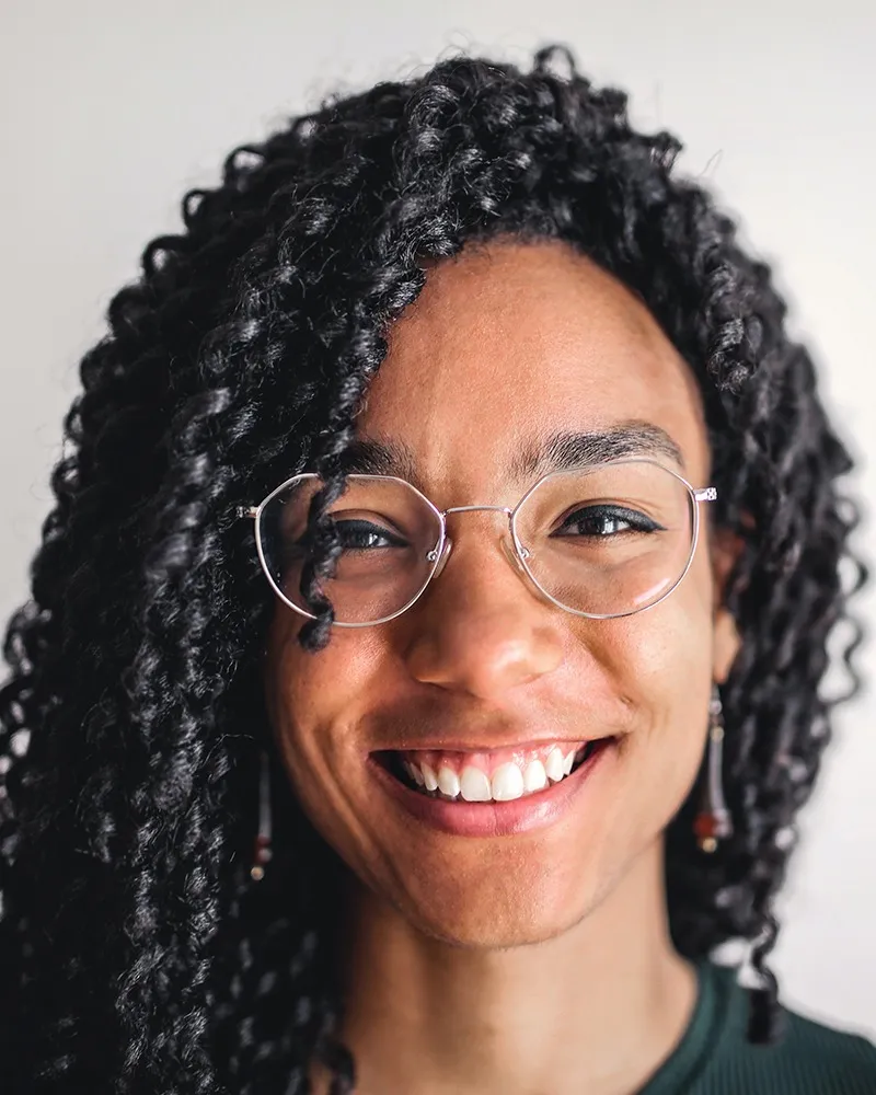 Black girl with glasses smiling