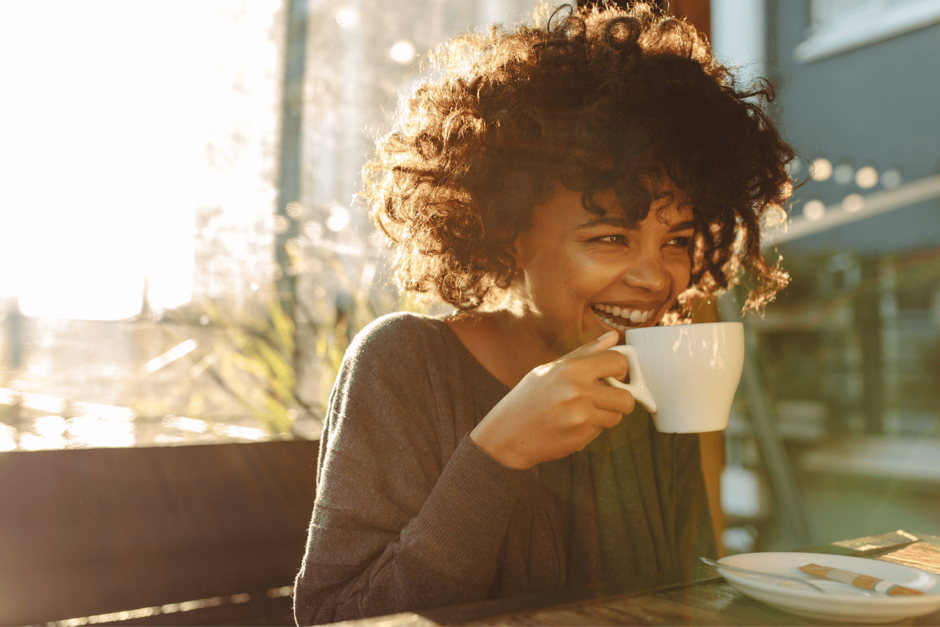 woman drinking coffee in a cafe