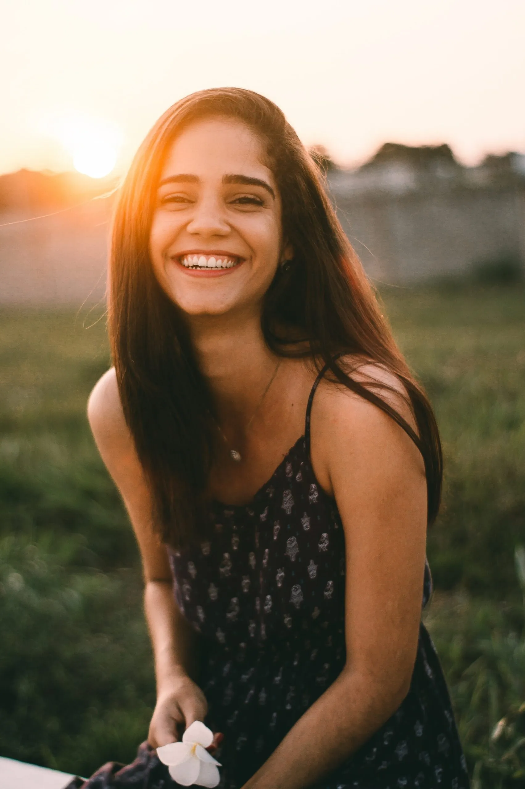 smiling woman at sunset