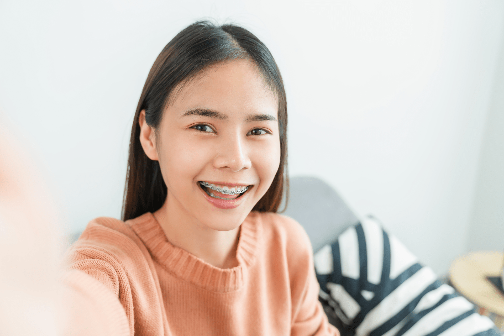 smiling girl with bright braces