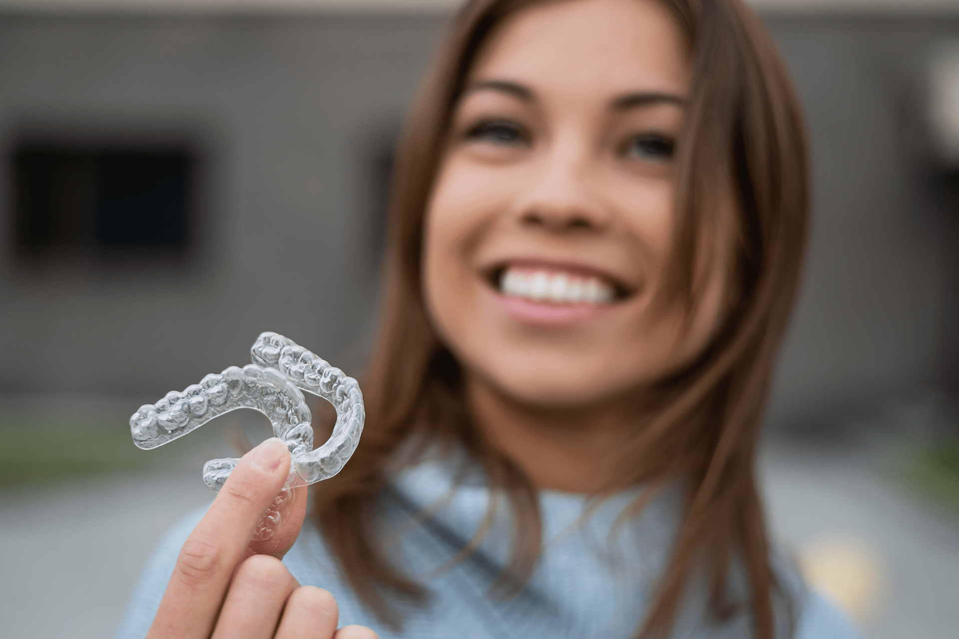 girl smiling with broken bracket braces