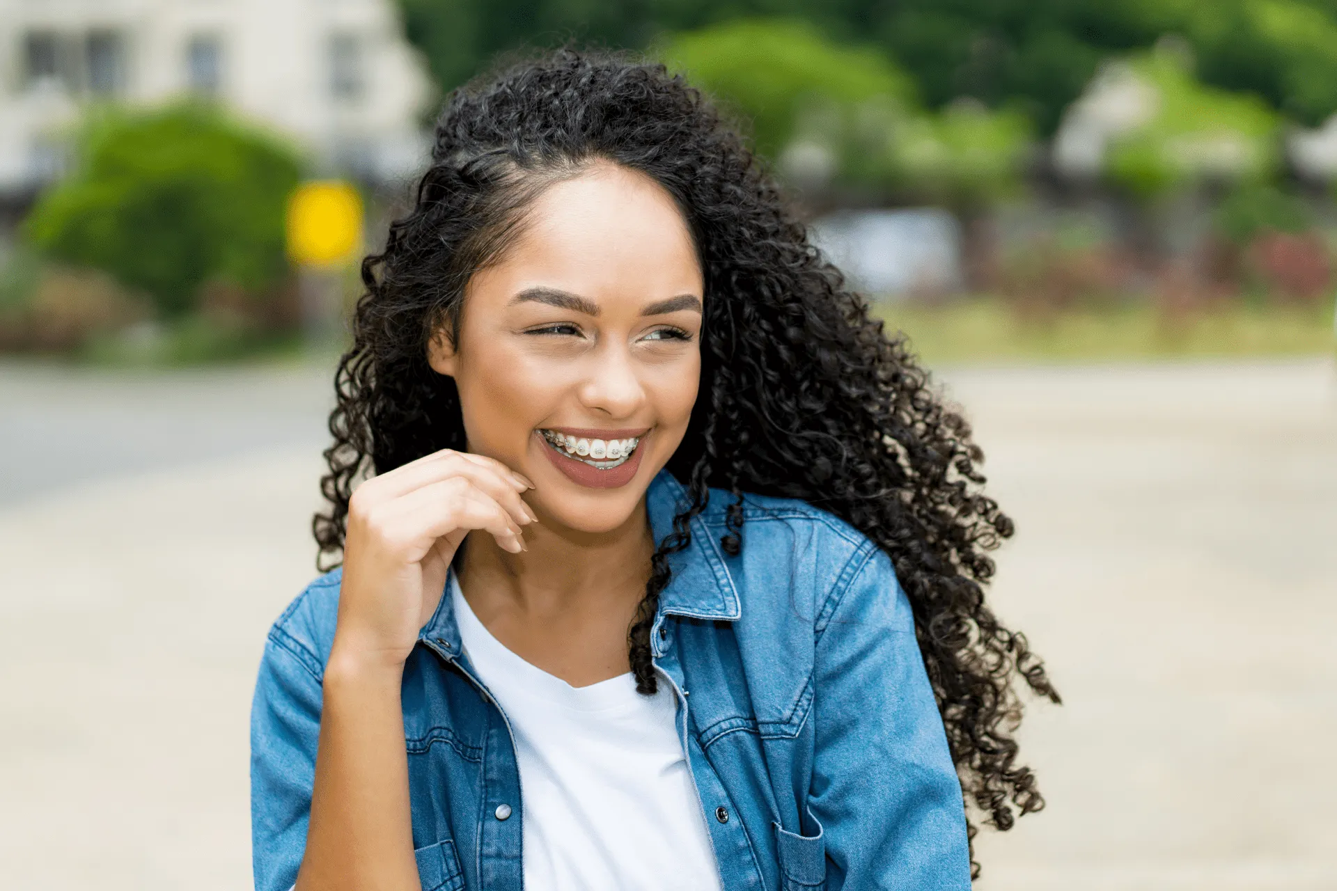 young girl with new braces smiling about starting orthodontic treatment