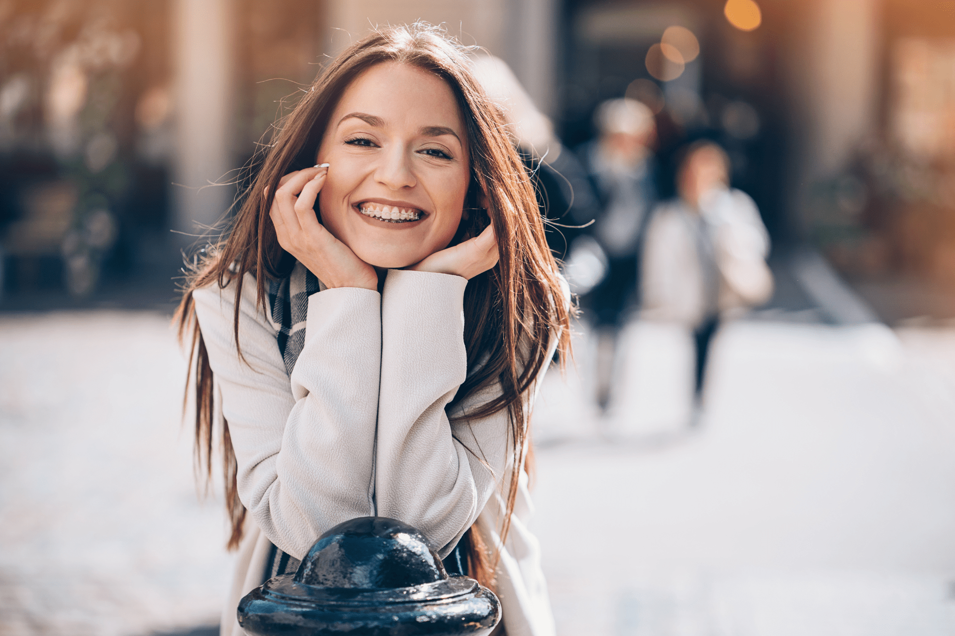 happy teenager with brand new ceramic braces